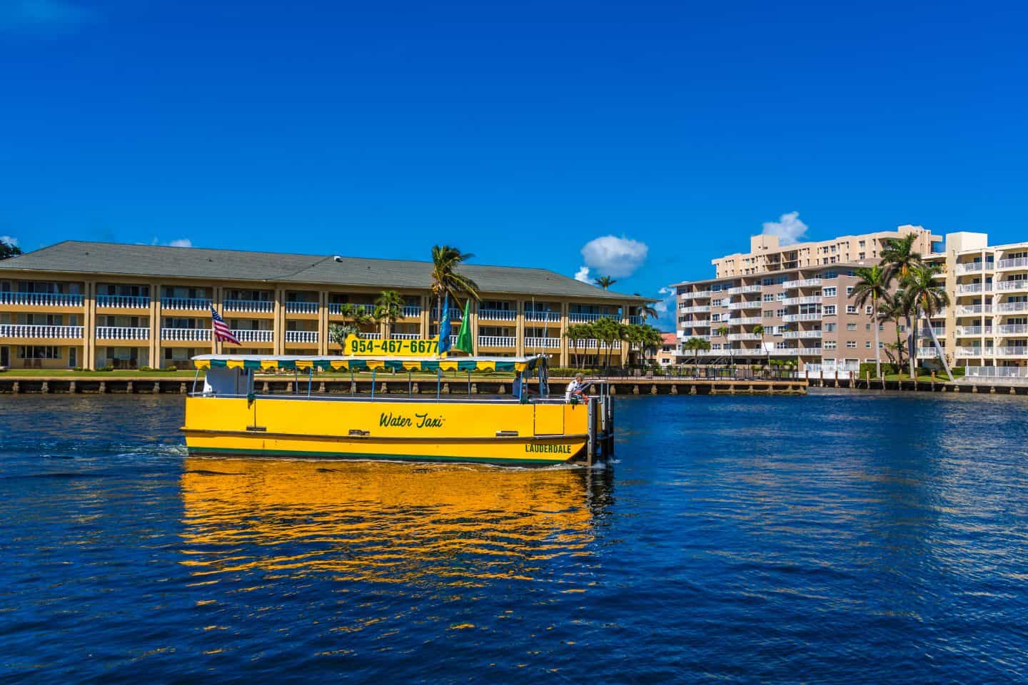 Yellow Water Taxi in Fort Lauderdale with blue sky