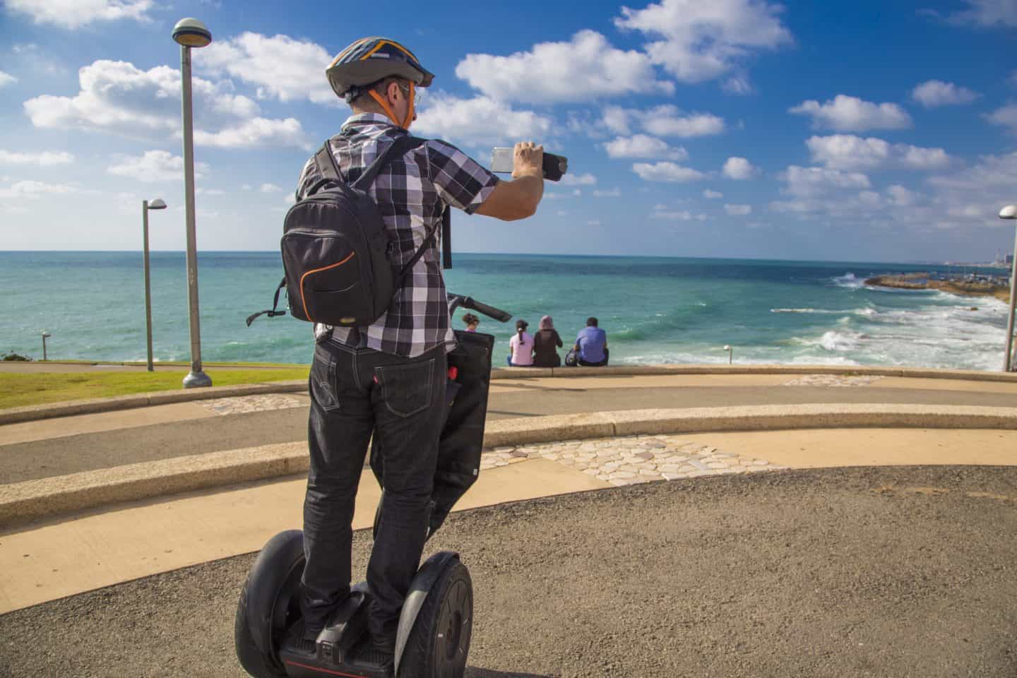 man with a helmet on a segway