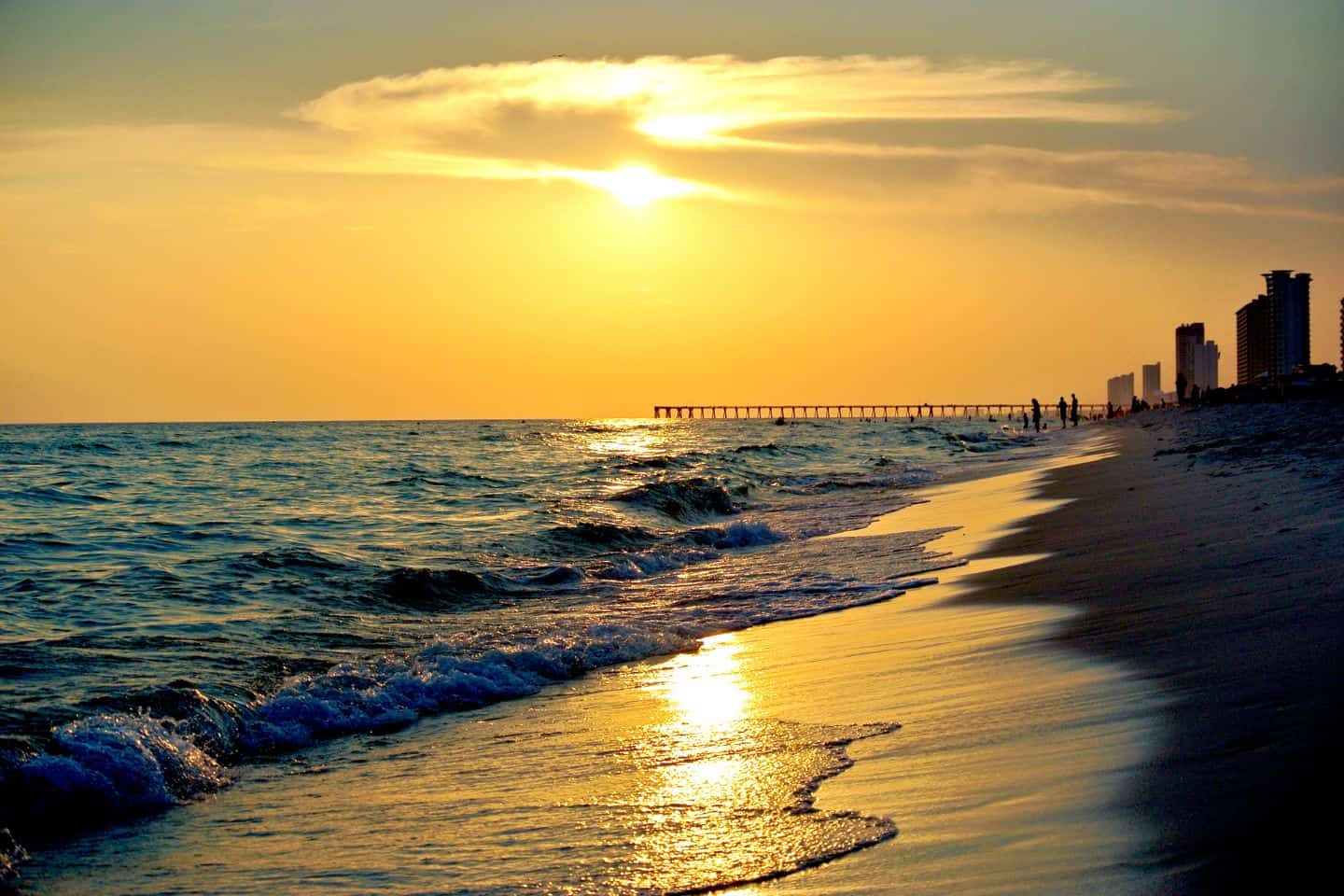 Sun setting with golden skies over Panama City Beach Florida
