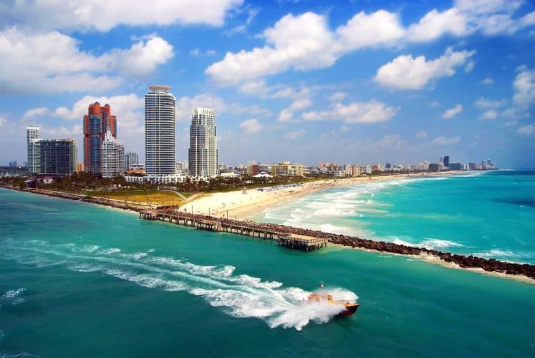 Speed Boat heading out into the open water out of Miami Inlet